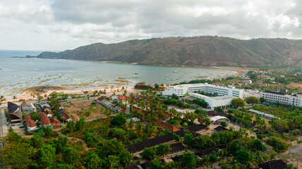 Obraz premium Aerial drone view of stunning Kuta Beach or Pantai Kuta in Kuta Mandalika, Lombok, Indonesia