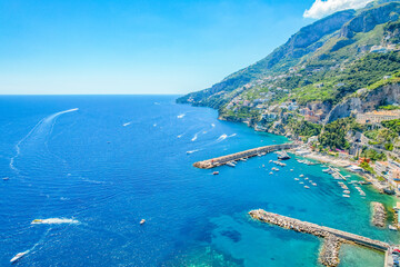 Amalfi on Amalfi Coast, Italy. Aerial photo of famous city Amalfi located on Amalfi Coast with blue sea water and beautiful colorful houses on the cliff