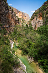 Pasarelas del Vero, walkways and footbridges along a scenic gorge with turquoise water in...