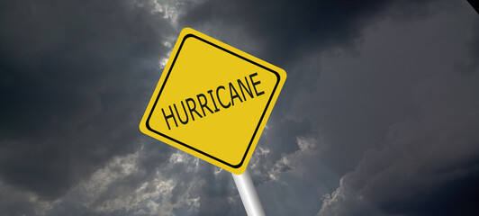 Hurricane season with symbol sign against a stormy background and copy space. dirty and angled sign adds to the drama. hurricane sign, hurricane season sing on cloudy background