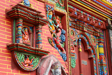  The ornate facade of Changunarayan Temple, Nepal's oldest Hindu temple, featuring intricate carvings and vibrant colours that reflect centuries of traditional craftsmanship and devotion.