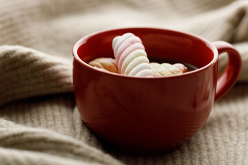 Cup of delicious hot chocolate on wooden table background.