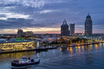 Fototapeta premium Downtown Mobile waterfront skyline at sunset