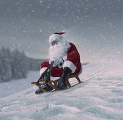 Santa Claus riding a small sleigh