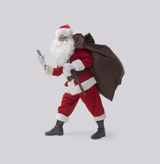 Funny Santa Claus using a smartphone