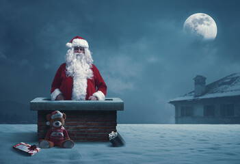 Funny Santa Claus stuck in a chimney