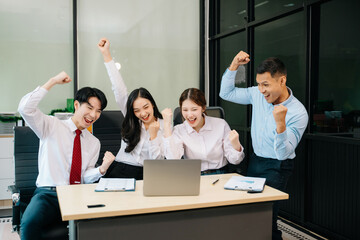 Happy businesspeople while collaborating on a new project in an office. Group of diverse businesspeople