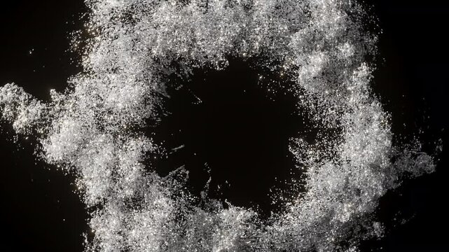 Silver round circle shape explosion with red shiny particles like a smok on a black and dark background. Holiday background. 3D animation footage.