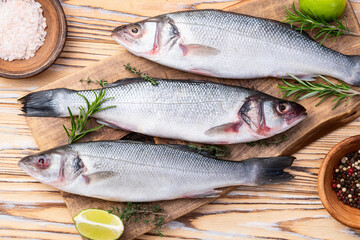 Raw sea bass fish photography . Top view