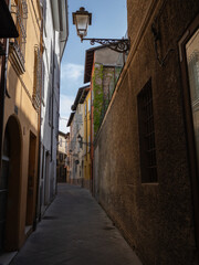 Narrow and Cramped Street with Antique Lamppost in Reggio Emilia, Italy