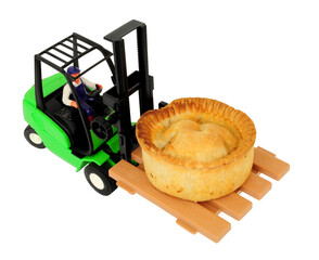 Toy forklift truck carrying a real meat pie isolated on a white background