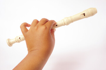 a man holding a white recorder stick with white background isolated