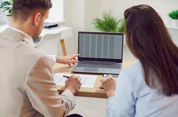 Business people working with laptop at office desk, doing accounting analysis on computer platform, analyzing cloud data statistics, busy with online trade market tech research, intern learning, rear 