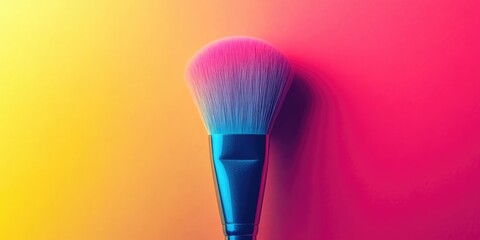 A luminous makeup brush set against a lively and bright pink and yellow backdrop. The vivid colors enhance the beauty of the radiant makeup brush.