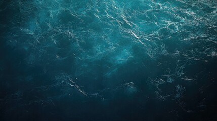 Aerial perspective of tranquil water waves in the sea highlights the vibrant turquoise hues, creating a serene ocean water background with ample copy space for design needs.
