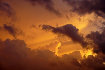 sky background with clouds and orange light