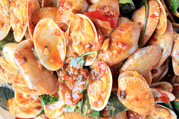 Stir fried striped clams with basil, chilli paste, garlic and fresh chilies