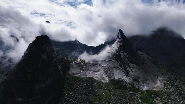 flying over rocks in the form of a parabola in the clouds