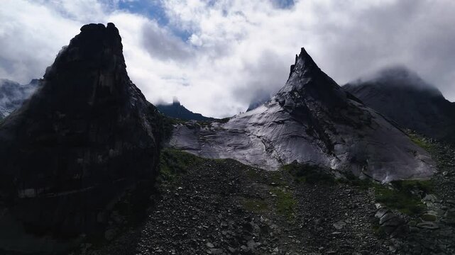 flying over rocks in the form of a parabola in the clouds