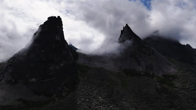 flying over rocks in the form of a parabola in the clouds