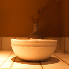 This is a Chinese ceramic bowl taken at a café, which can be used to hold food.
