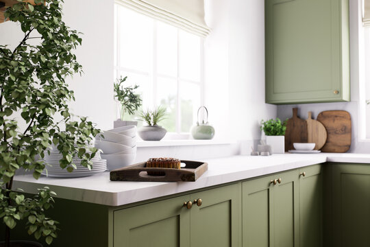 Stylish green kitchen with abundant natural lighting and modern aesthetic design