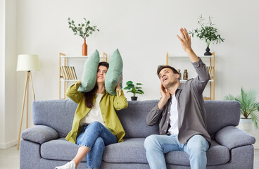 Young annoyed married couple suffers from noisy loud neighbors from above. Frustrated woman closes...