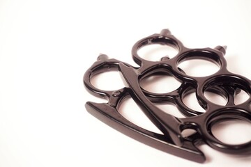 two black brass knuckles with white background isolated