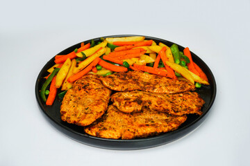 Chicken stake with fried vegetables 