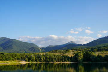 Belizmata Dam with a backdrop of the Pirin Mountains, Bansko, Bulgaria