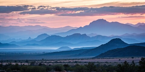 Soft Pastel Hues in Minimalist Landscape with Sweeping Mountain Silhouettes at Dusk or Dawn