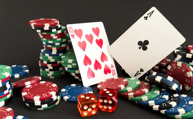 Playing cards and poker chips on table