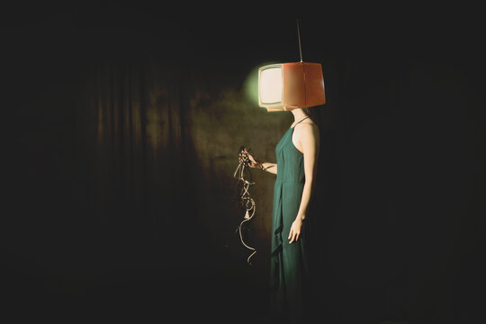 Surreal woman with TV on her face unplugs connection cables, freedom concept