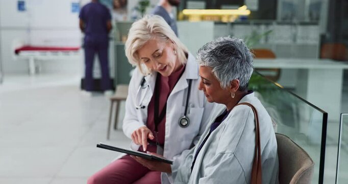 Mature woman, doctor and tablet for medical services, appointment or consultation with professional. Female people, handshake and conversation with tech for checkup, visit or examination in hospital