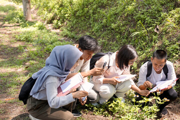 Students Engaged in Field Research Outdoors