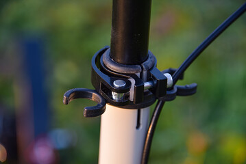 Clamp for adjusting the height of the handlebars on a scooter with holders.