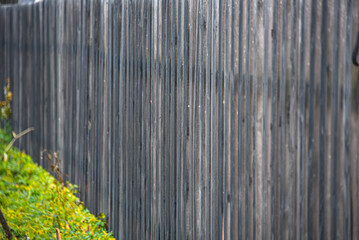 Wooden fence made of grey picket fence.