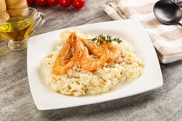 Italian risotto with prawn served thyme