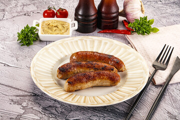 Delicous natural roasted sausages in the plate