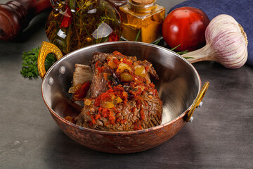 Baked beef ribs with vegetables