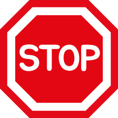 Red octagonal stop sign on the road signaling caution and safety