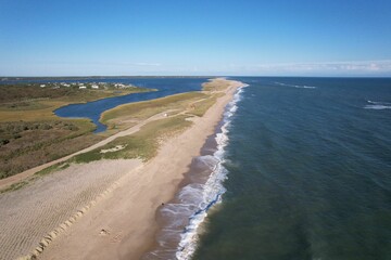 Aerial view of a sandy beach and coastal landscape.