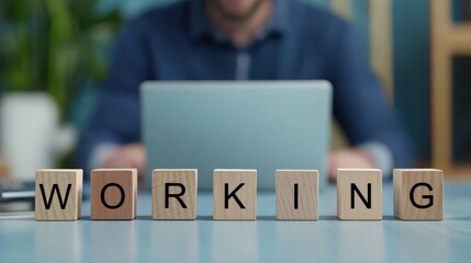 Working word wooden block stand on office desk background for productive and motivation purpose.