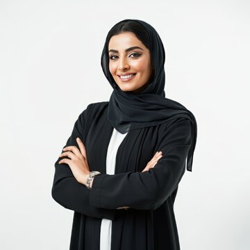 a close-up of a smiling Saudi Arabian Gulf woman wearing the hijab looking somewhere with gestures of self-confidence and joy, the concept of femininity and softness among Saudi women