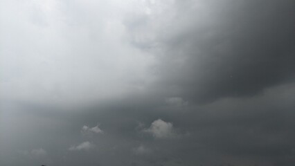 A dark, ominous sky dominated by a large, menacing cloud. Indicating the potential for severe...
