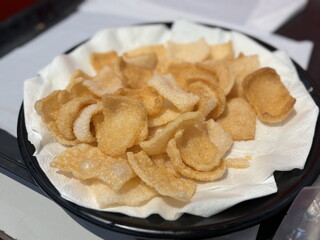 Crispy Prawn Crackers. Fresh crunchy prawn crackers on white dish