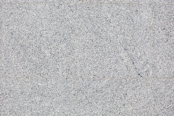 A gray tile floor with a pattern of small squares