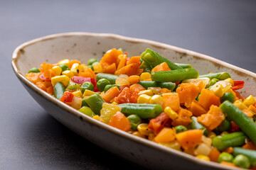 Mexican Mix of Vegetables. Tomatoes, Green Beans, Peas, Corn. Dietary Food.Bright vegetable mix .Vegetarian food.Assorted.