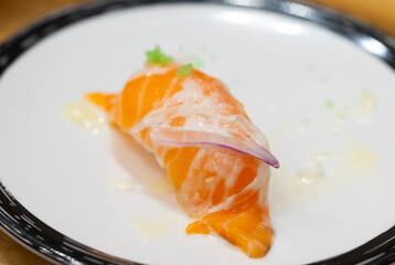 Japanese Nigiri sushi with raw salmon fillet. Sake sashimi with rice. 