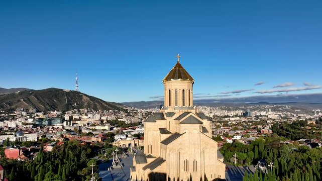 Holy Trinity Cathedral or Tsminda Sameba Church aerial panoramic view in Tbilisi old town. Tbilisi is the capital and the largest city of Georgia